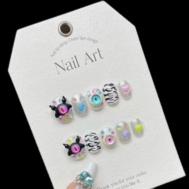 Faux ongles mignons en forme d'oeil du diable